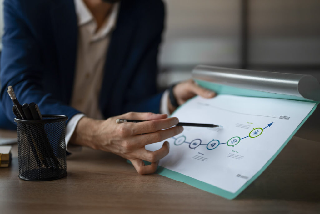 person office analyzing checking finance graphs